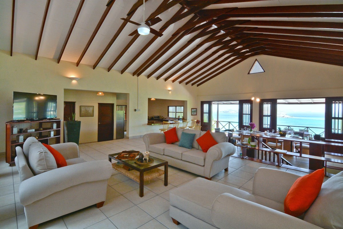 Spacious open living room at Villa Marisol with vaulted ceiling and sea views